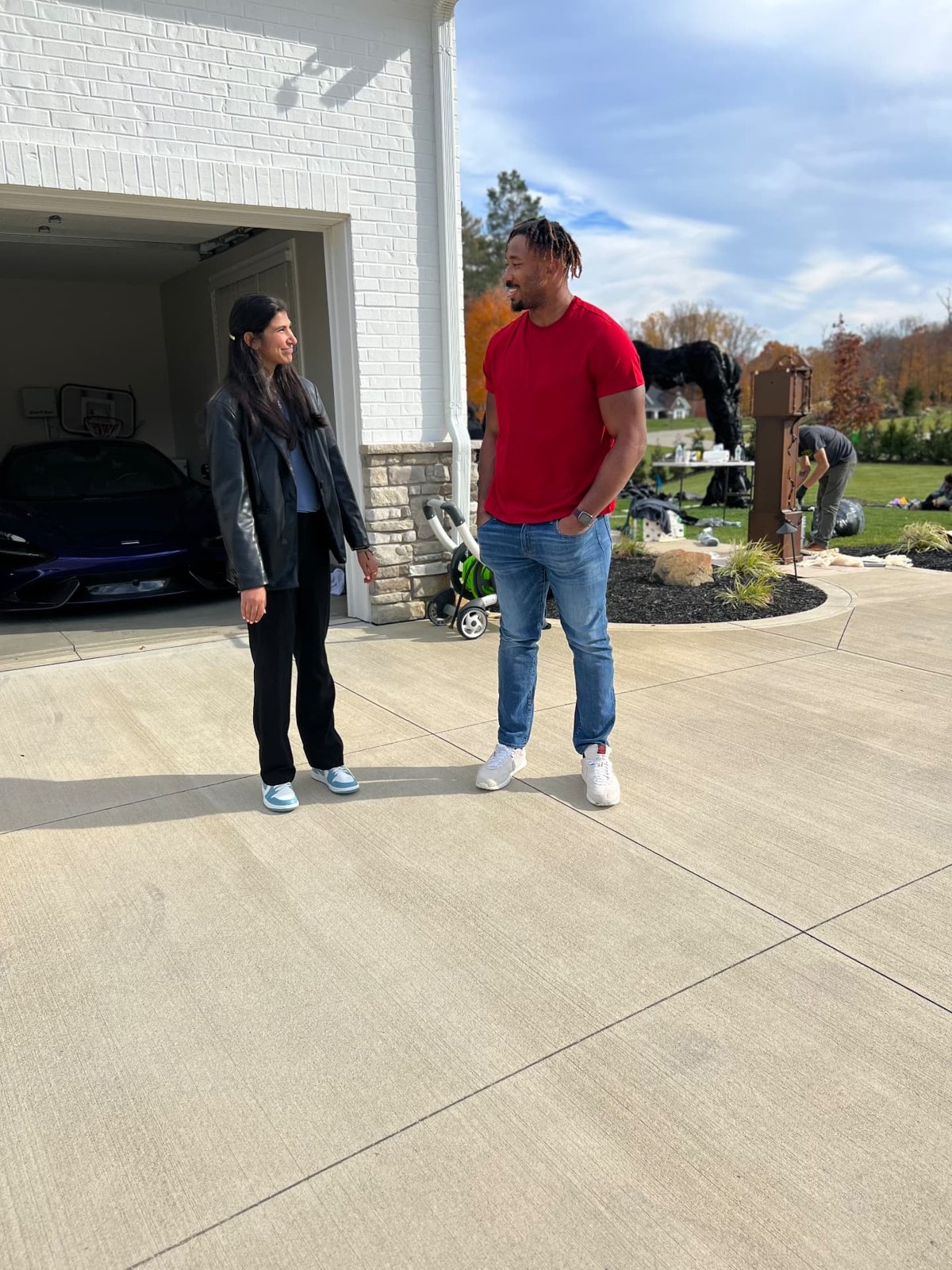 Reilly talking with NFL defensive end Myles Garrett on location