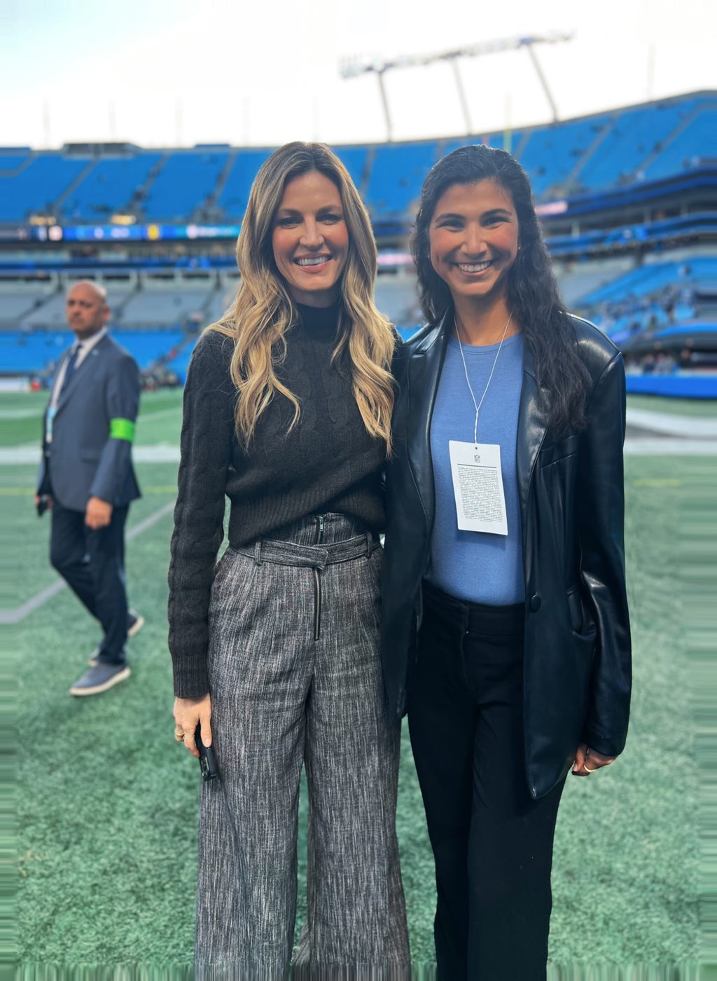 Reilly Biller Kinzel with Erin Andrews on the field at Bank of America Stadium before an NFL game